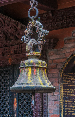 Bell covered in colour pigment in the temple.