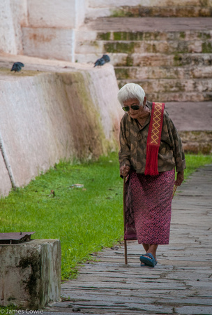 Old lady coming from the temple.