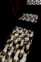 Light enters and cast shadows on the inlaid marble floor of The Jewel Box or the Baby Taj