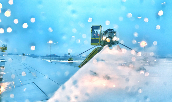 Departure Day - Pushing back Pearson Airport Toronto. Deicing underway. Image by Laurie Ann Milne.